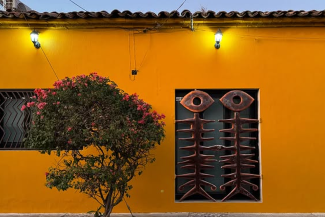 Yellow colonial building in Tequila, Jalisco with vibrant shadows — part of the town’s charm on TQM’s tour