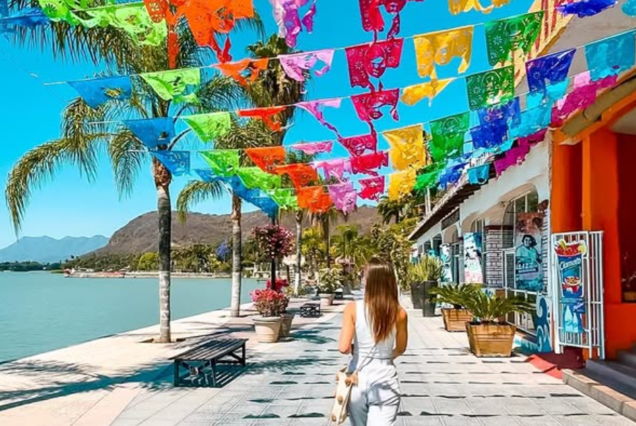 CHAPALA sign with blooming pink flowers in Jalisco — featured photo stop on TQM’s lakeside cultural tour