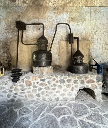 Historic stone distilling setup at the Jose Cuervo Express Premium Plus in Tequila, Mexico.