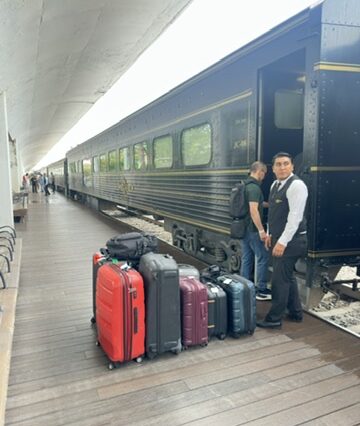Guests boarding the Jose Cuervo Express Premium Plus train with luggage in Tequila, Mexico.