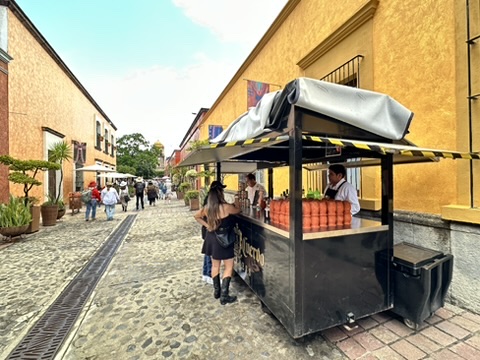 Tequila vendor cart outside La Rojeña at the Jose Cuervo Express Premium Plus experience in Tequila, Mexico.