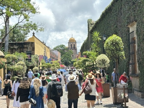 Guests walking the colorful streets of Tequila during the Jose Cuervo Express Premium Plus experience.