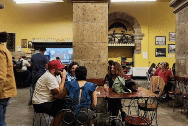 Guadalajara tour stop at La Fuente cantina interior with patrons and musicians