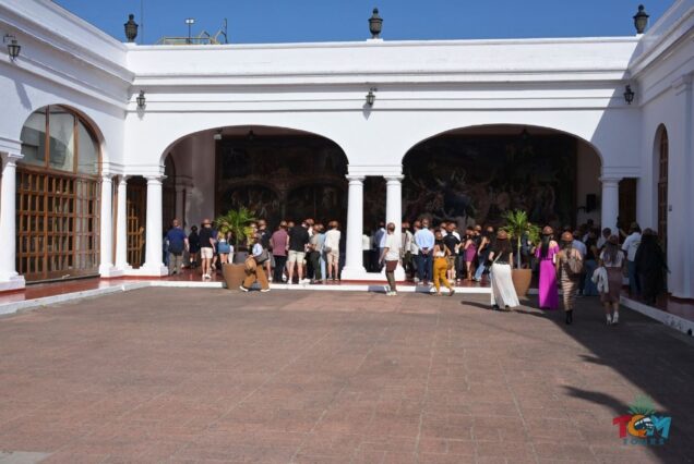 Large tour group gathers in the main courtyard of Casa Sauza during the tequila train experience.
